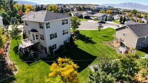 Aerial view of residential area featuring a mountainous background