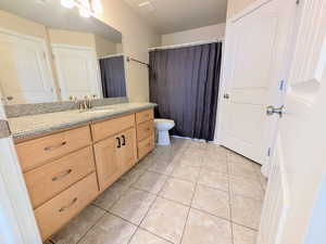 Bathroom with vanity and light tile patterned floors