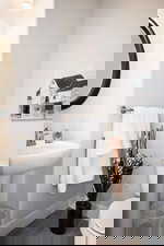 Bathroom with wood finished floors and toilet