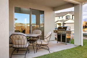 View of patio / terrace with a grill and outdoor dining space