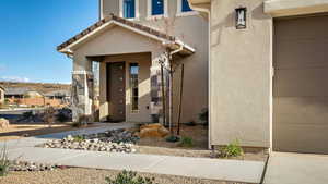 Doorway to property with stucco siding