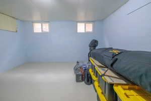Bedroom featuring concrete floors