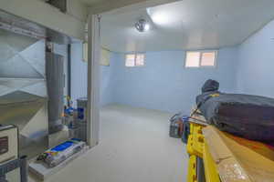 Basement with water heater and heating unit