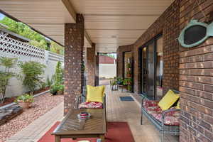 Fenced backyard with a patio