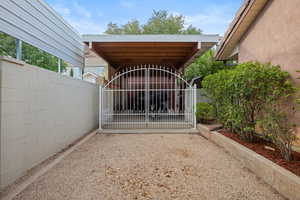 Gate featuring a patio
