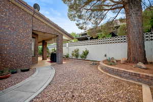 Fenced backyard with a patio
