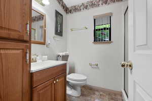 Full bathroom with vanity and an enclosed shower