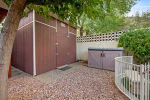 View of shed featuring a fenced backyard