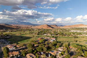 Mountain view featuring a local golf course and nearby suburban area