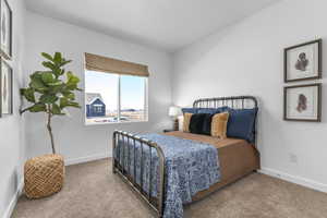 Bedroom with carpet and baseboards