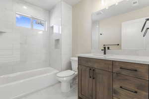 Full bath with vanity and shower / washtub combination