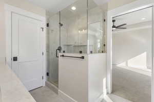 Bathroom with a shower stall, recessed lighting, carpet floors, and ceiling fan