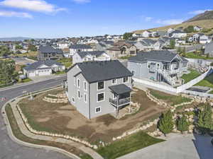Aerial perspective of suburban area with a mountain backdrop