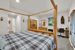 Bedroom with carpet flooring, recessed lighting, and a desk