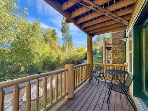 Wooden terrace with view of scattered trees