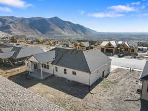 Aerial perspective of suburban area featuring a mountainous background
