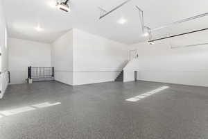 Garage featuring a garage door opener