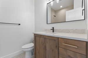 Full bathroom featuring vanity and light tile patterned flooring