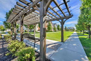 View of home's community with a lawn, a residential view, and a pergola