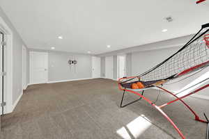 Rec room with carpet floors and recessed lighting