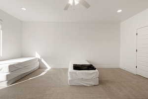 Unfurnished bedroom featuring recessed lighting, carpet, and ceiling fan