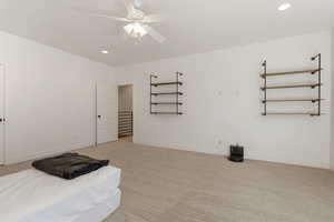 Unfurnished bedroom with light colored carpet, recessed lighting, and ceiling fan