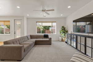 Living room featuring recessed lighting, ceiling fan, and light colored carpet