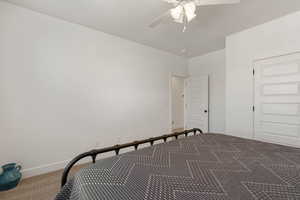 Bedroom with carpet and ceiling fan