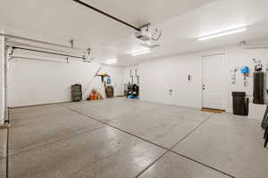 Garage featuring a garage door opener