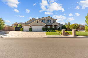 View of front of house with concrete driveway, stucco siding, and a garage