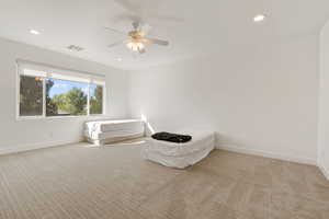 Bedroom with recessed lighting, light colored carpet, and a ceiling fan