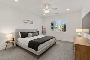 Carpeted bedroom with recessed lighting and a ceiling fan