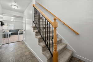 Entry and beautiful stair rail to upper floor