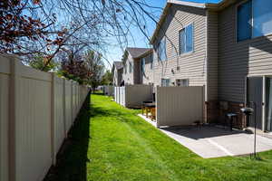 View of yard featuring a patio and a residential view
