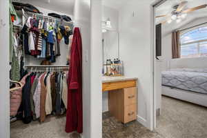 Owner's bathroom with extra mirrored area and walk-in closet