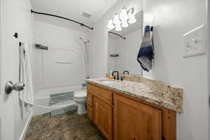 Main Upper Floor Bathroom featuring shower / tub combo with curtain and vanity