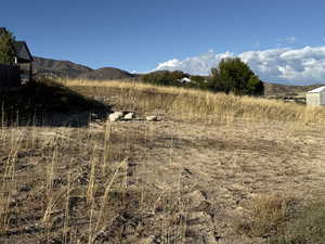 View of mountain background featuring rural landscape