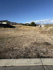 View of yard with a mountain view and a view of rural / pastoral area