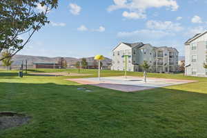 View of property's community featuring a yard and a mountain view