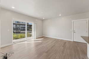 Spare room with recessed lighting and light wood-style flooring
