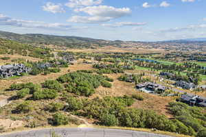 Aerial perspective of suburban area with a water and mountain view