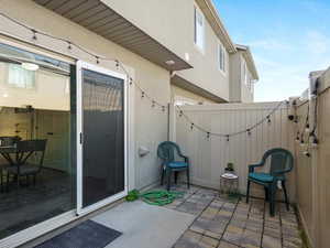View of patio featuring a gate