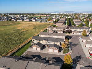 Aerial view of residential area featuring a mountainous background