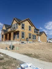 Back of house featuring a porch