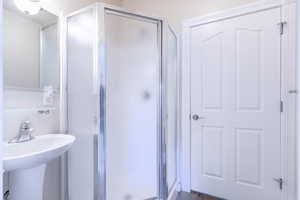 3/4 Bathroom off of the flex room with a stall shower and tile patterned floors