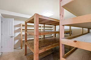 Bedroom currently set up for storage but could easily be made into a bedroom by adding carpet.