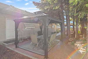 View of patio featuring a gazebo and outdoor dining space