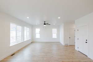 Spare room with recessed lighting, light wood-style floors, and ceiling fan