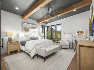 Bedroom featuring beam ceiling, recessed lighting, a ceiling fan, and wood finished floors