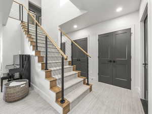 Staircase featuring recessed lighting and carpet